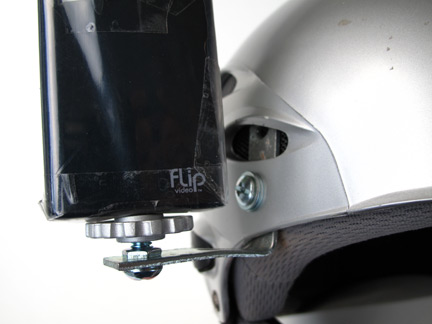 The nut and bolt attachment point on the helmet allows the L bracket to pivot when loosened for a quick pitch adjustment of the camera. 
